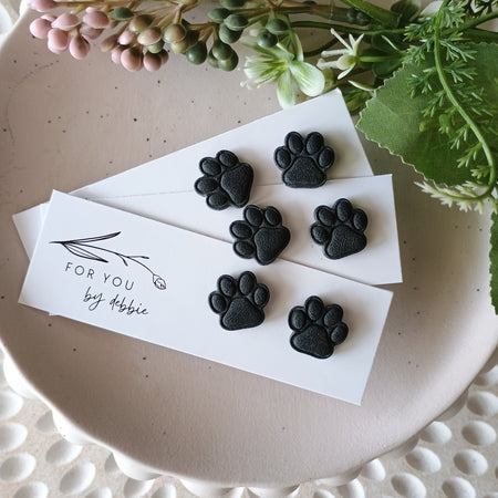 Black paw print stud earrings