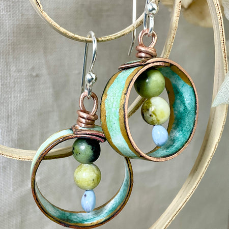Teal gold and white enamel earrings with gemstone beads.