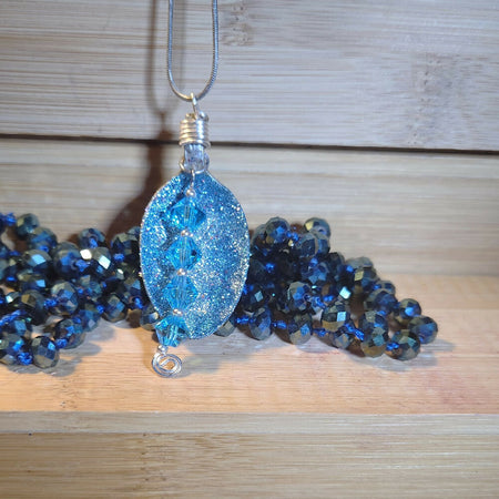 Pendant necklace. Recycled spoon with blue crystals.
