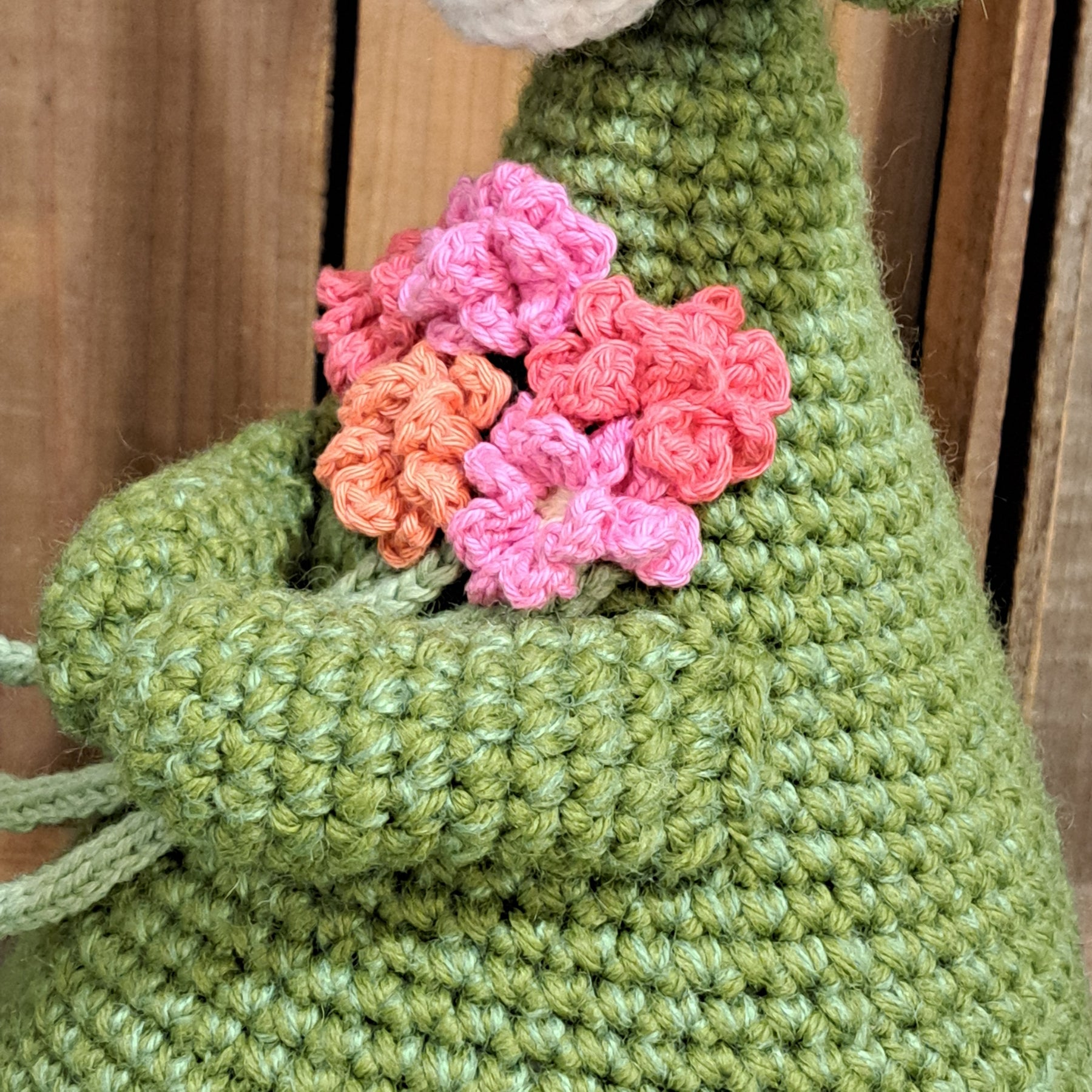 Handmade Highland cow crochet character doorstop in green