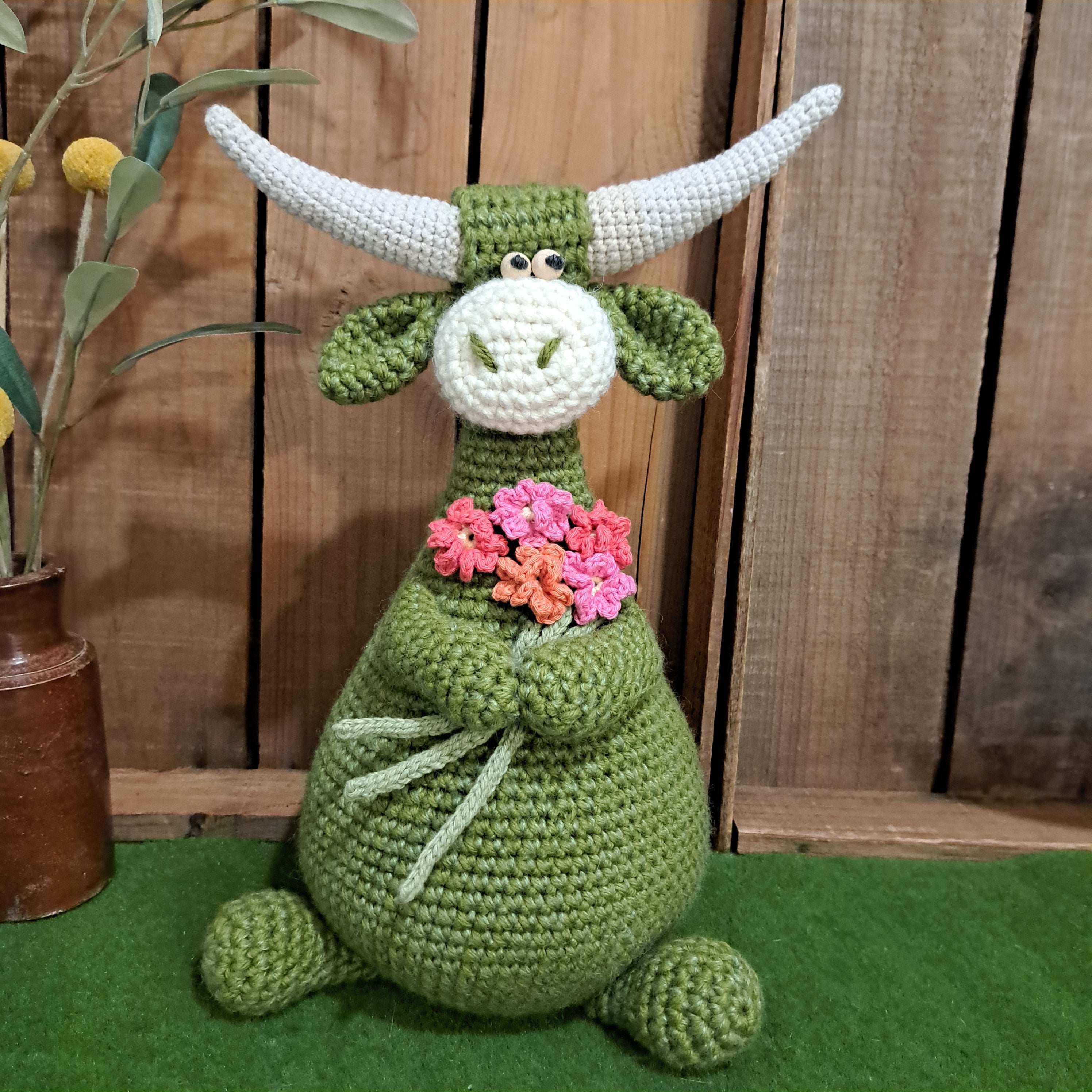 Handmade Highland cow crochet character doorstop in green