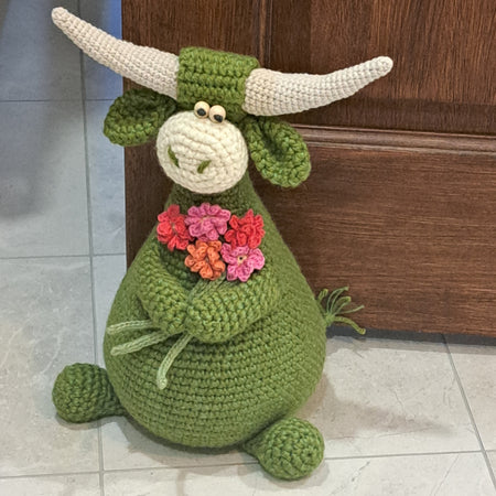 Handmade Highland cow crochet character doorstop in green