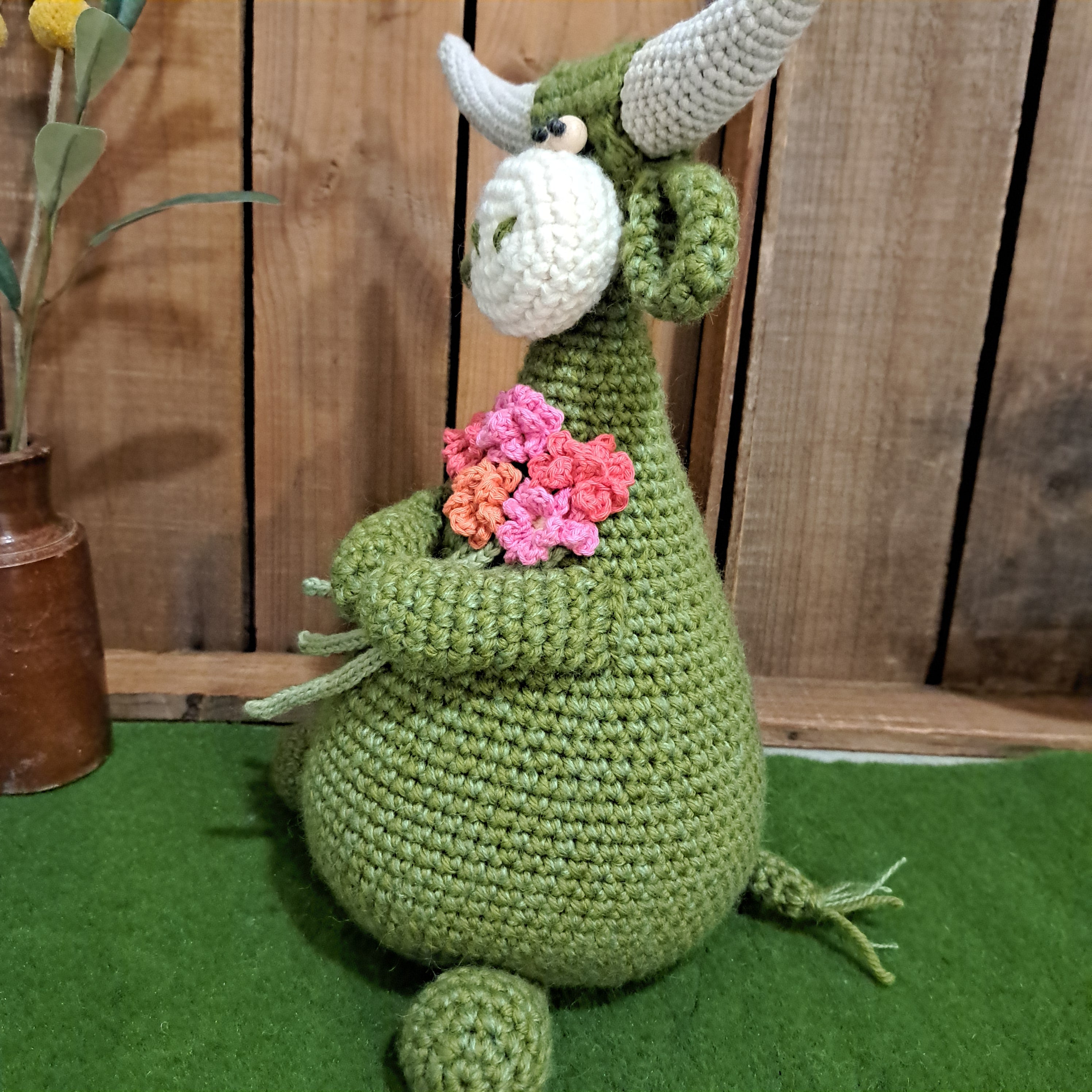 Handmade Highland cow crochet character doorstop in green