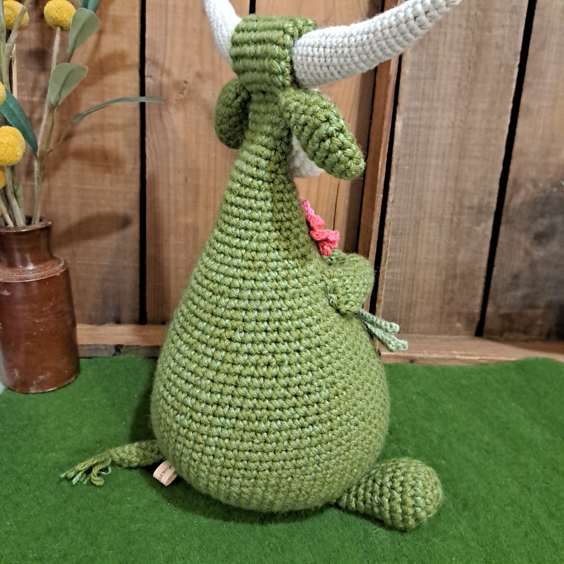 Handmade Highland cow crochet character doorstop in green