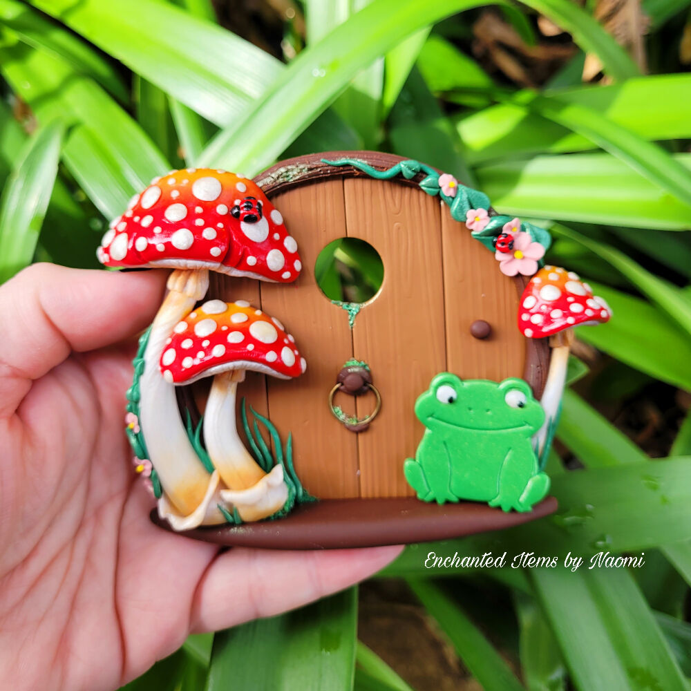 A little Frog at a Mushroom Fairy Door