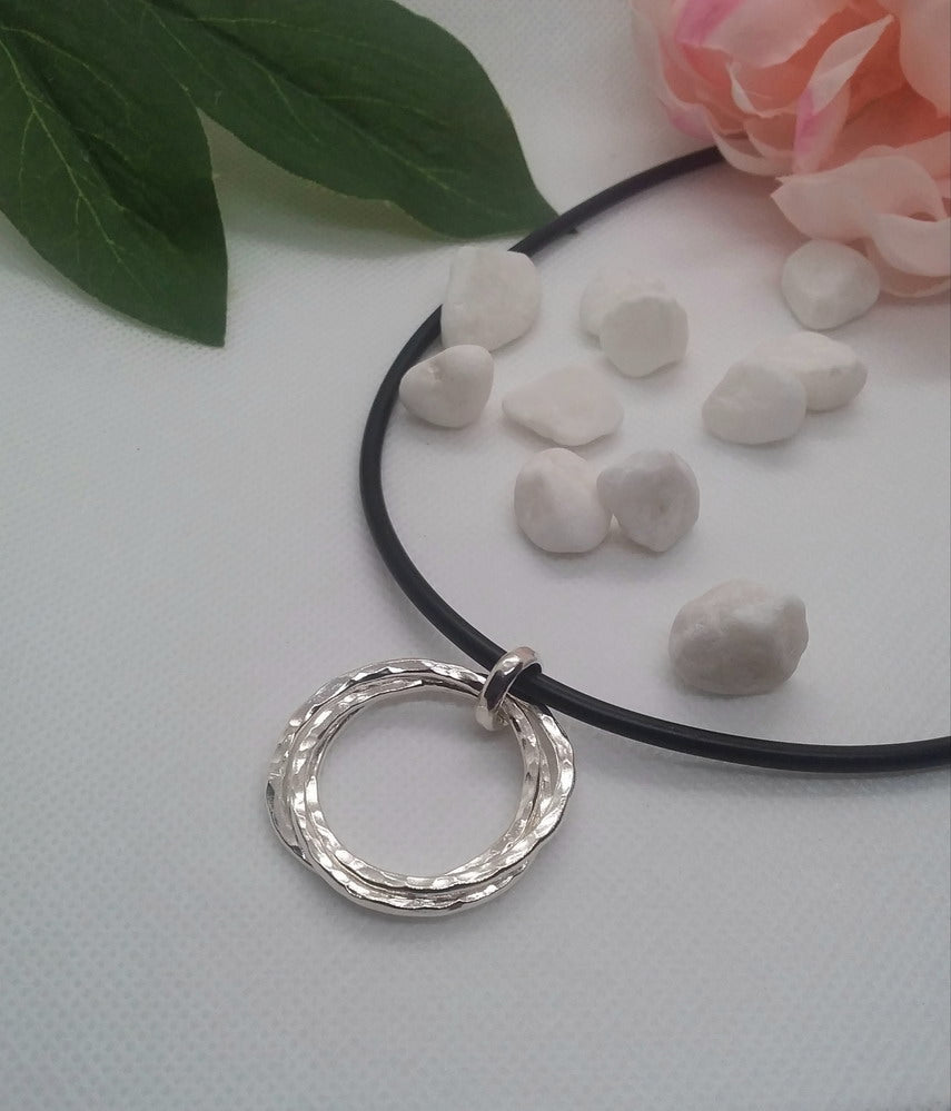 Sterling Silver three circle pendant with neoprene black neckpiece