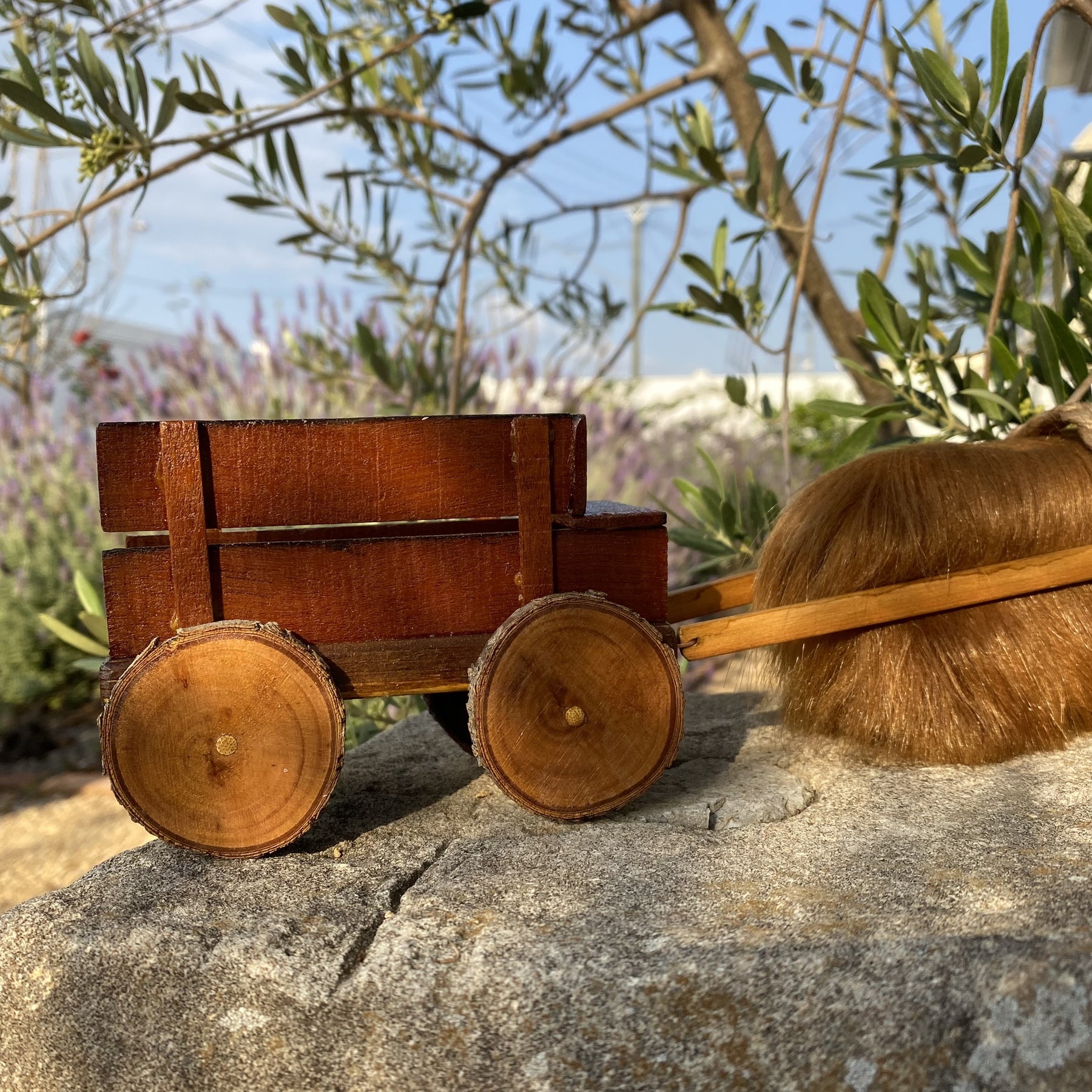 Handmade wooden cow and wagon