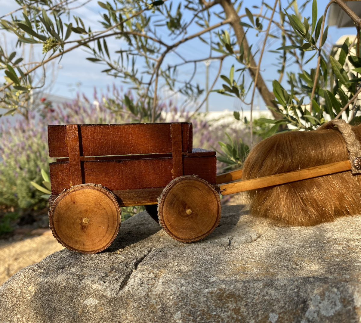 Handmade wooden cow and wagon
