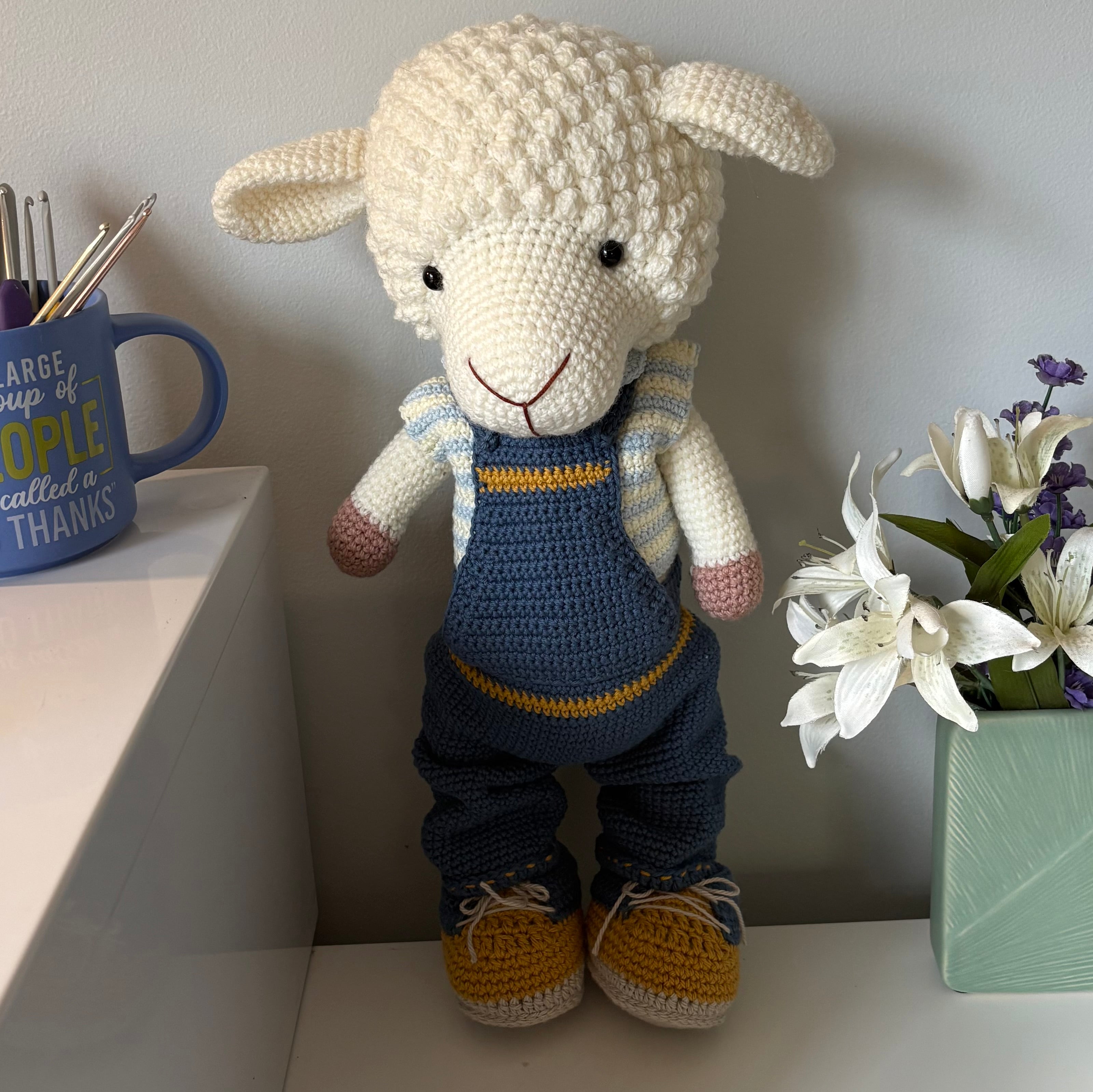 Lamb in overalls and hat