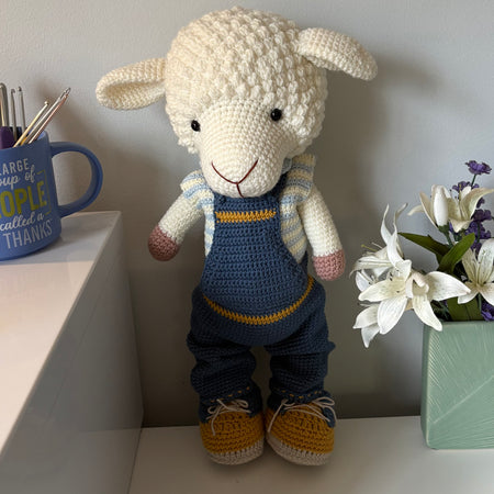 Lamb in overalls and hat