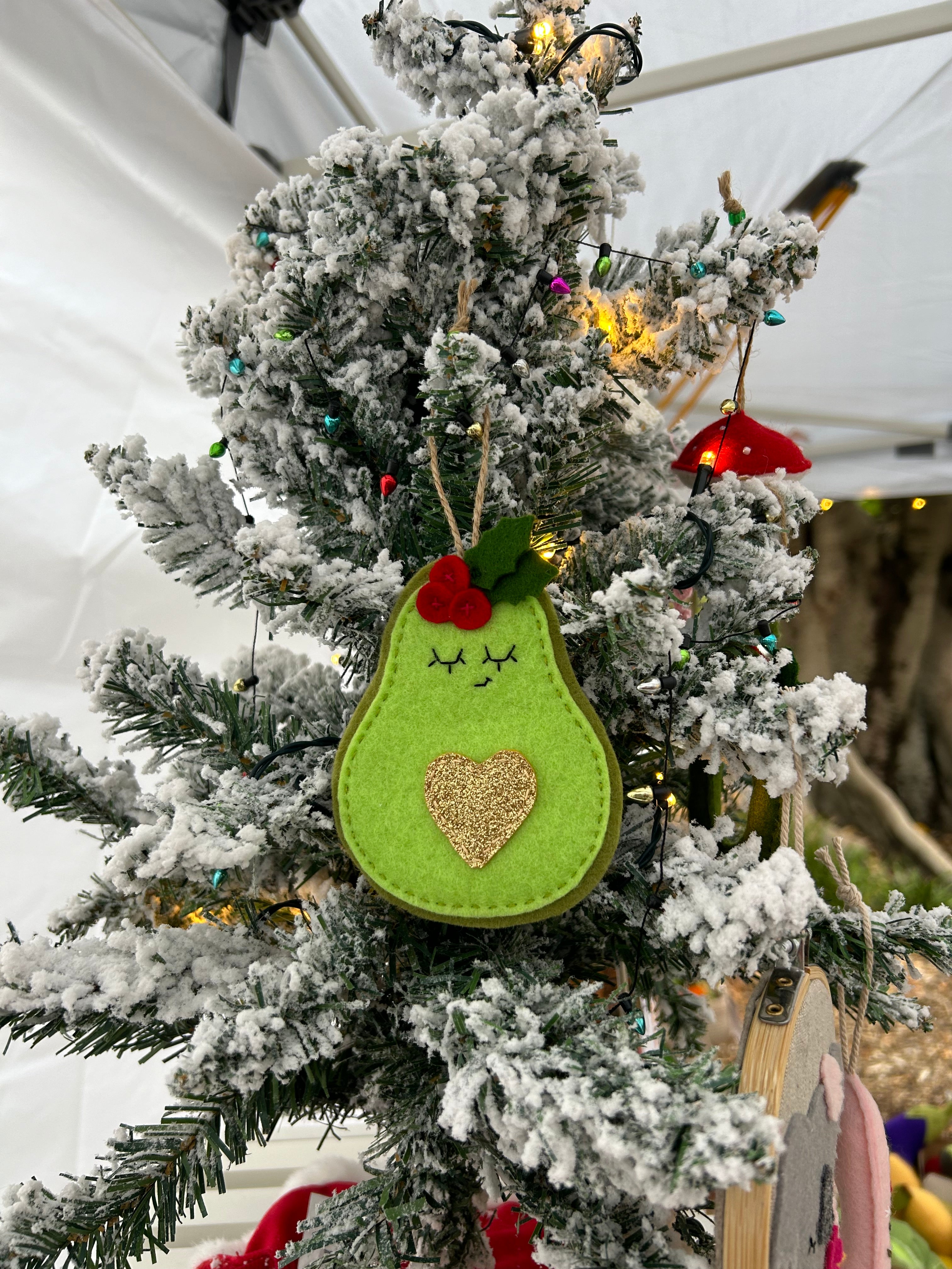 Festive avocado ornament with golden heart