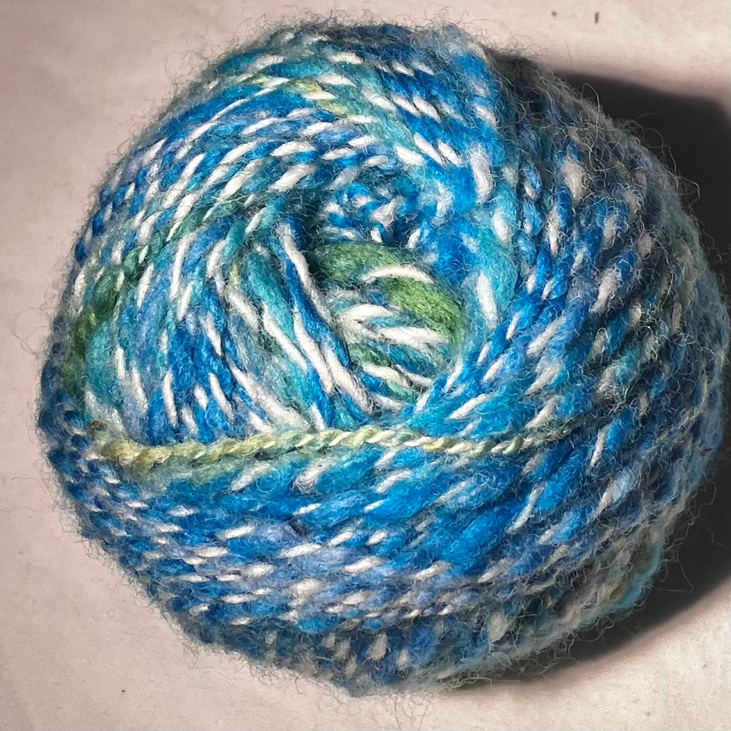 Wool cake in blues and greens