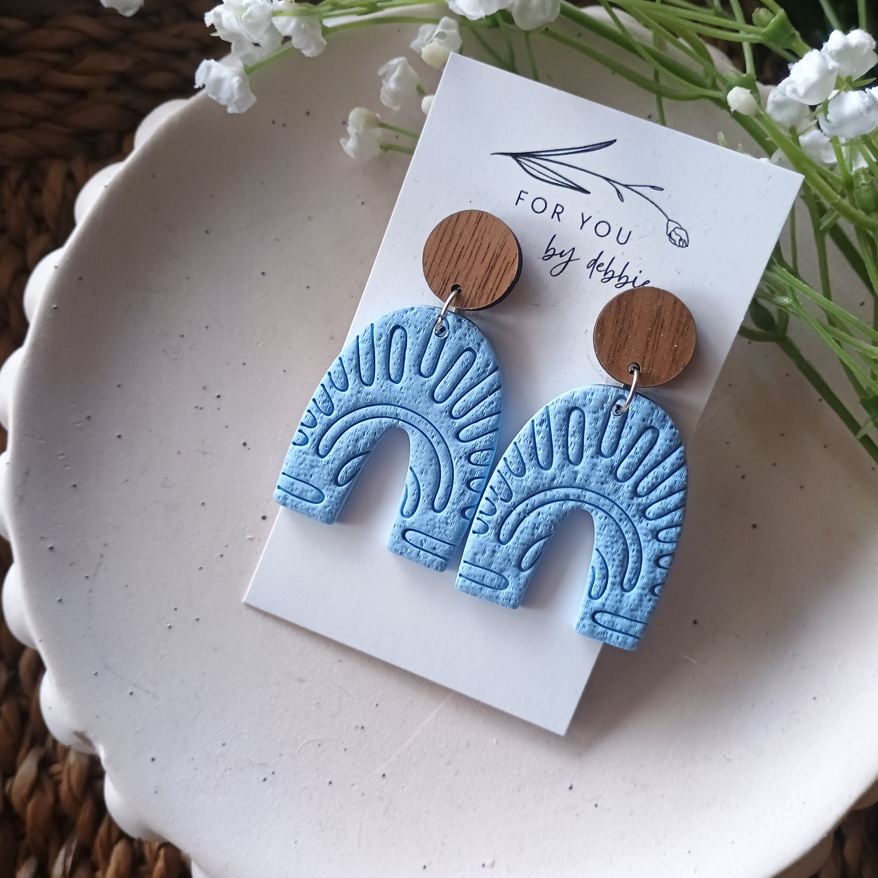 Embossed blue arch earrings with natural wood stud top