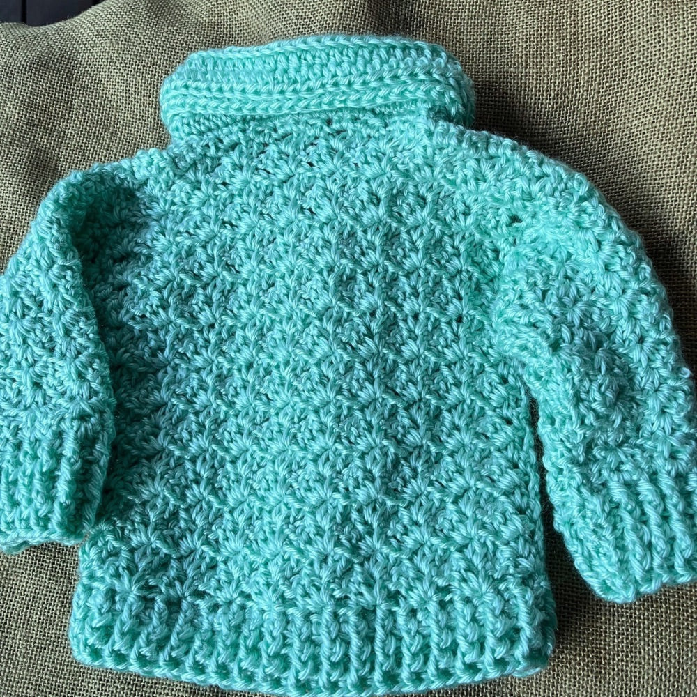Handmade crochet baby jumper with collar