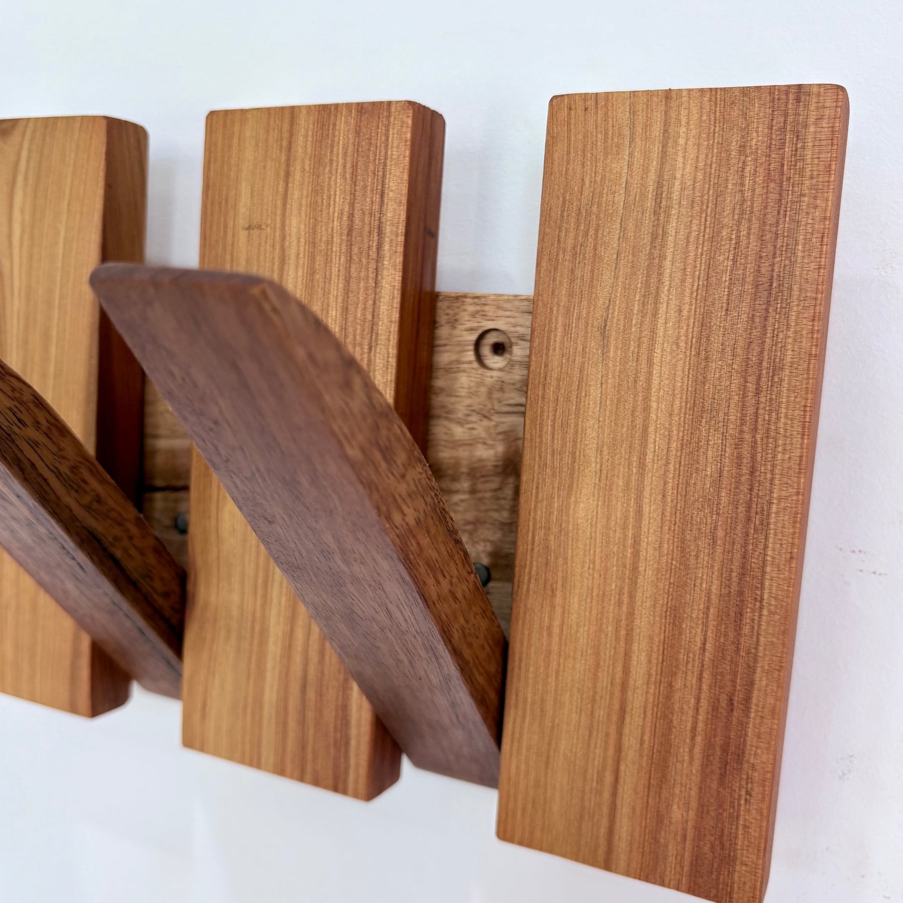 Two tone spotted gum and cypress horizon line piano style coatrack