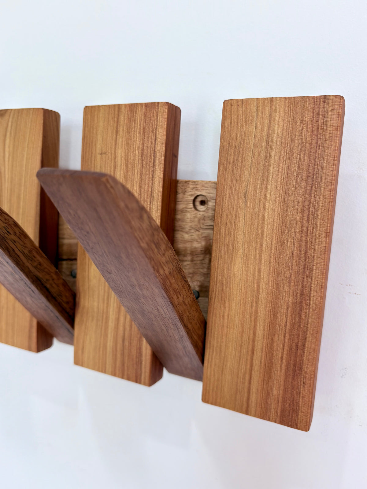 Two tone spotted gum and cypress horizon line piano style coatrack
