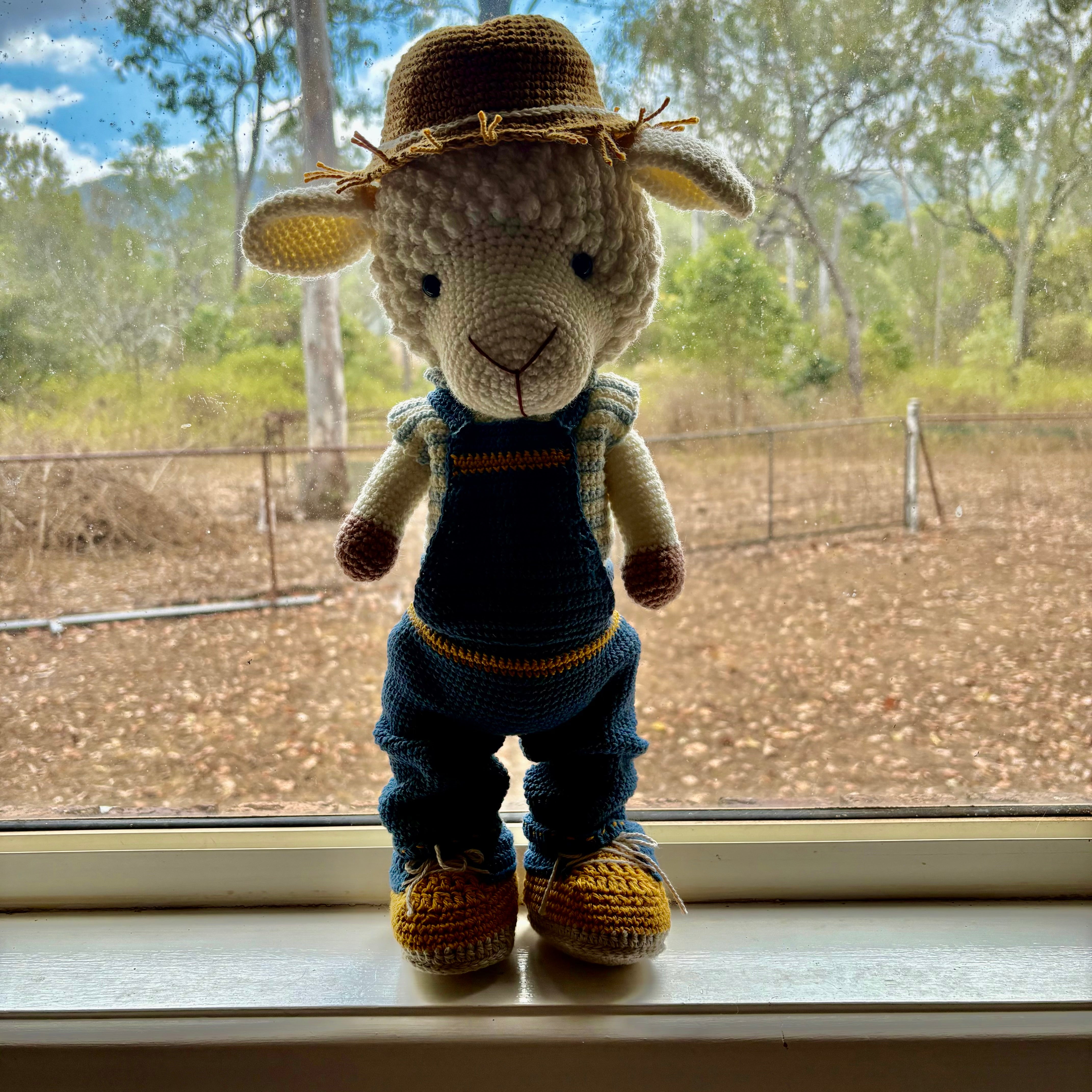 Lamb in overalls and hat
