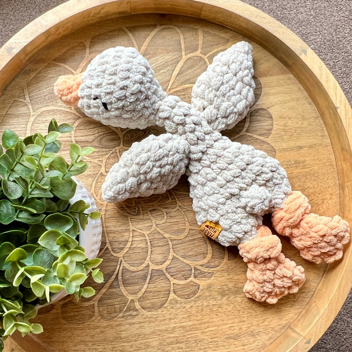 Handmade crochet Mini Goose modern lovey with knotted legs.