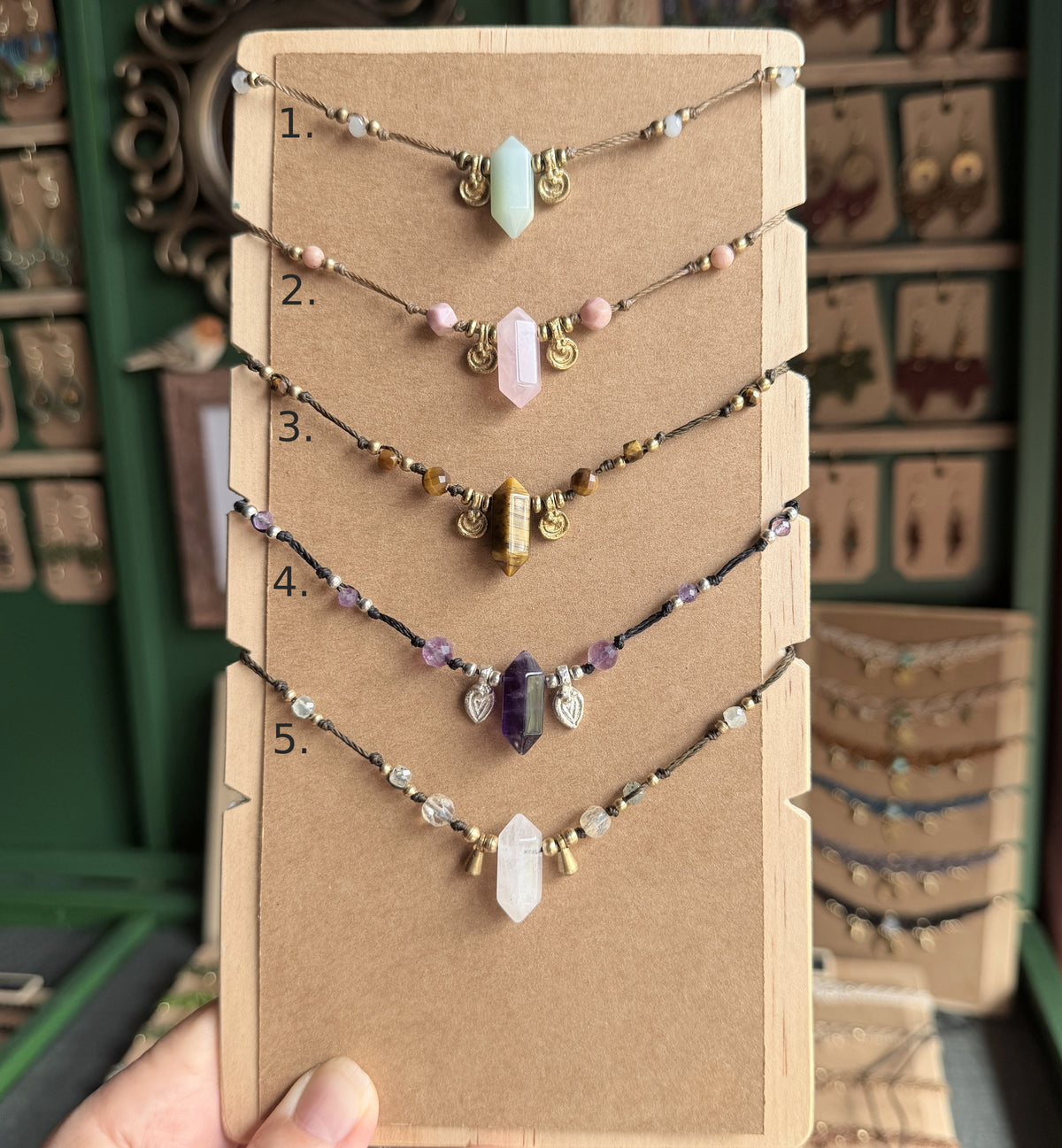 Crystal point necklace with faceted beads and solid brass charm