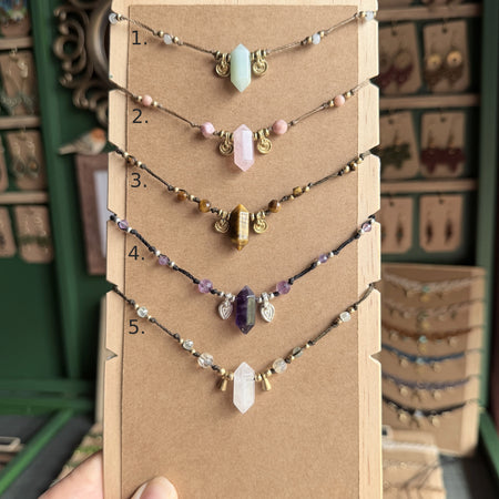 Crystal point necklace with faceted beads and solid brass charm