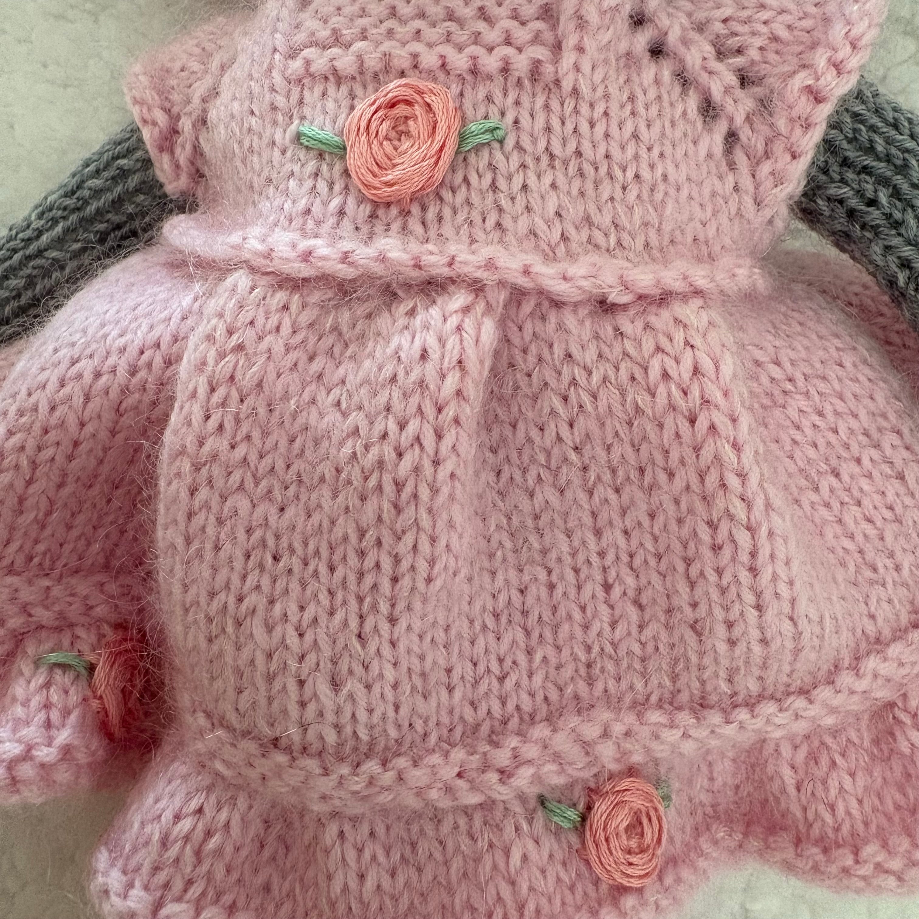 Little knitted bear in dress and beret