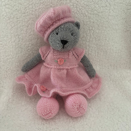 Little knitted bear in dress and beret