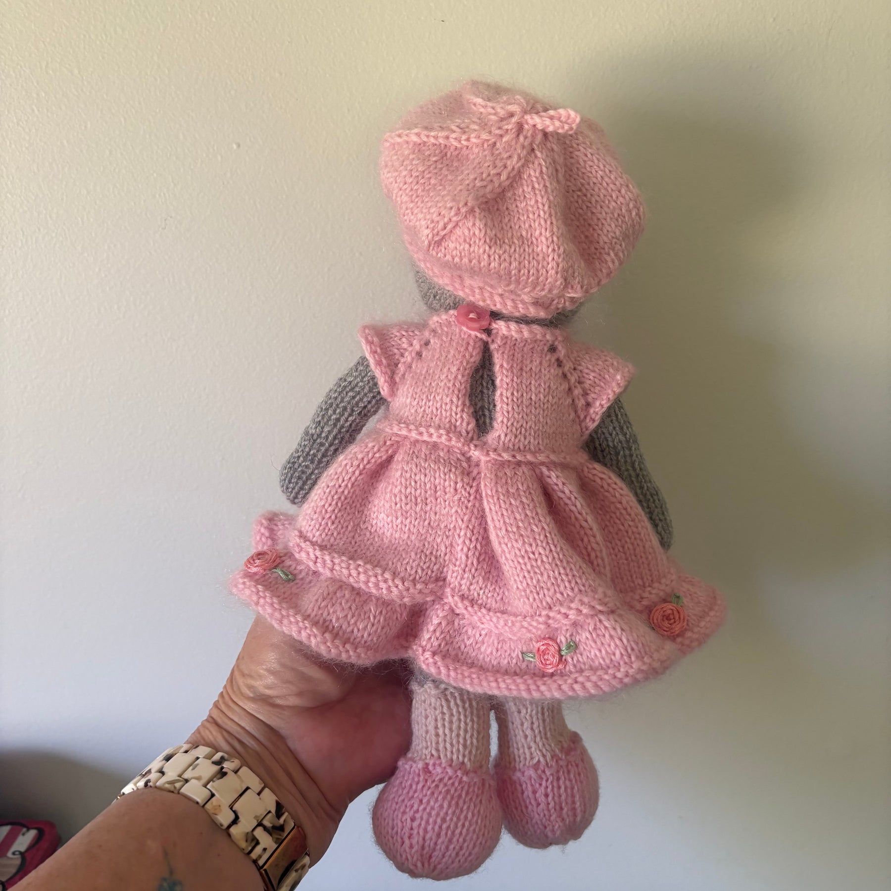 Little knitted bear in dress and beret