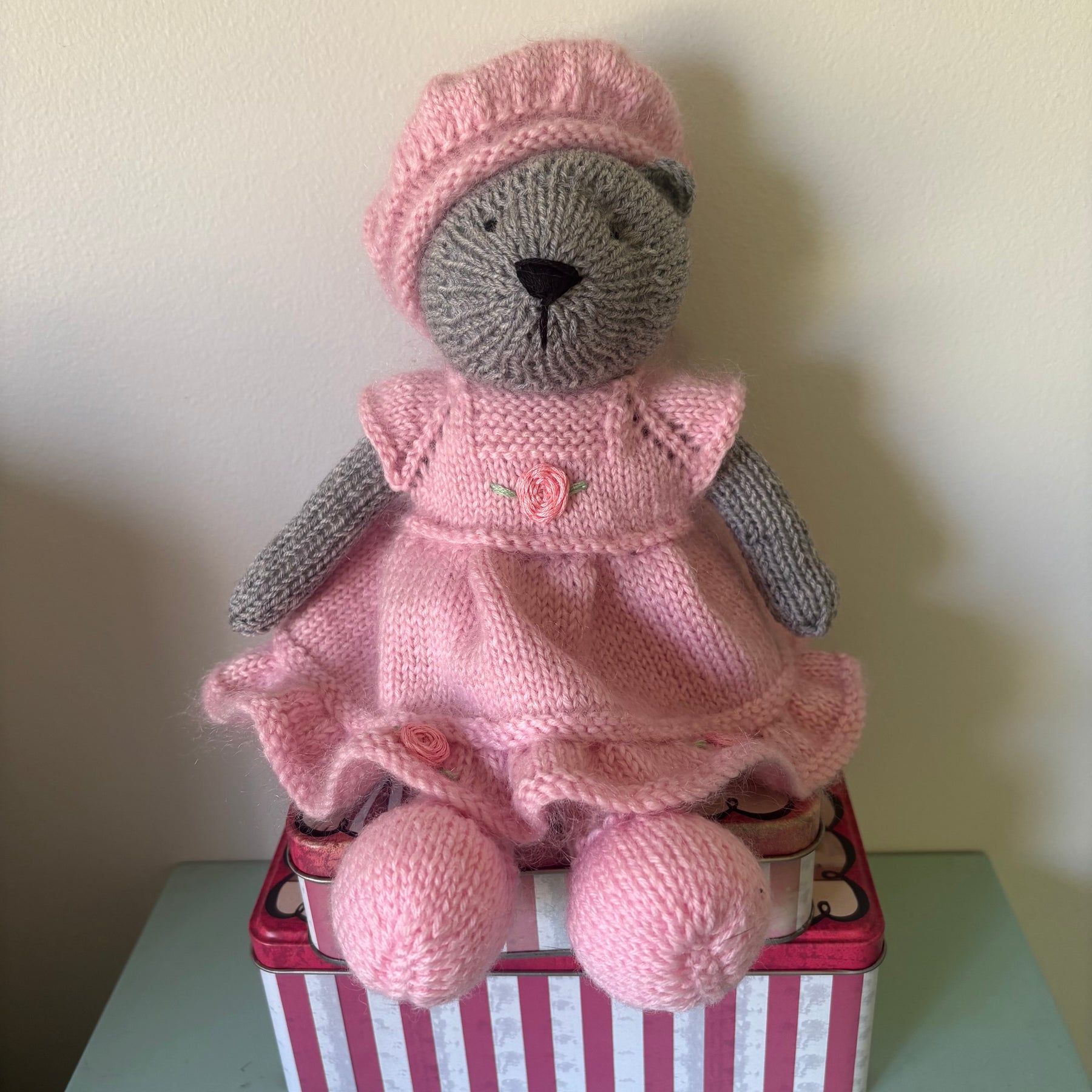 Little knitted bear in dress and beret