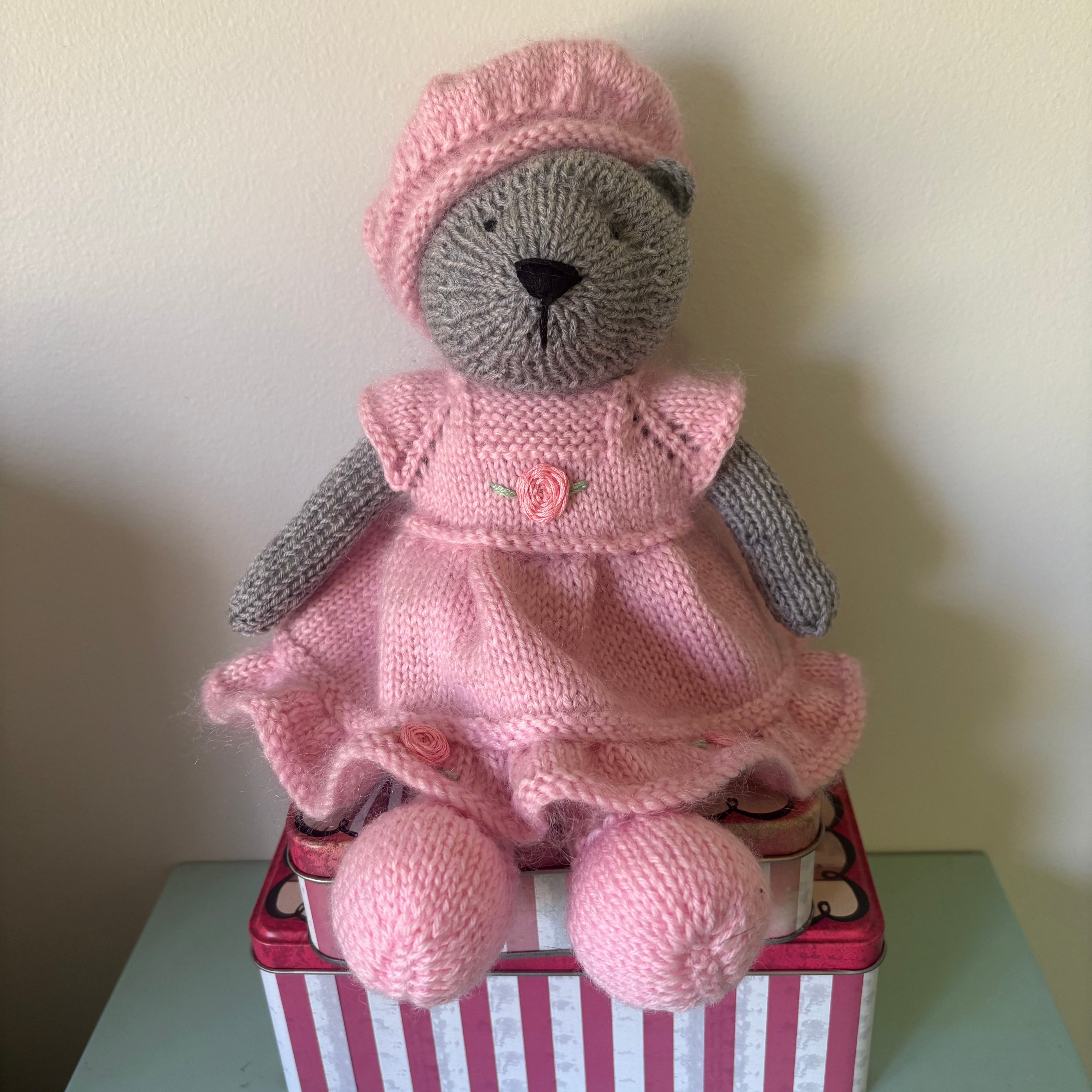 Little knitted bear in dress and beret