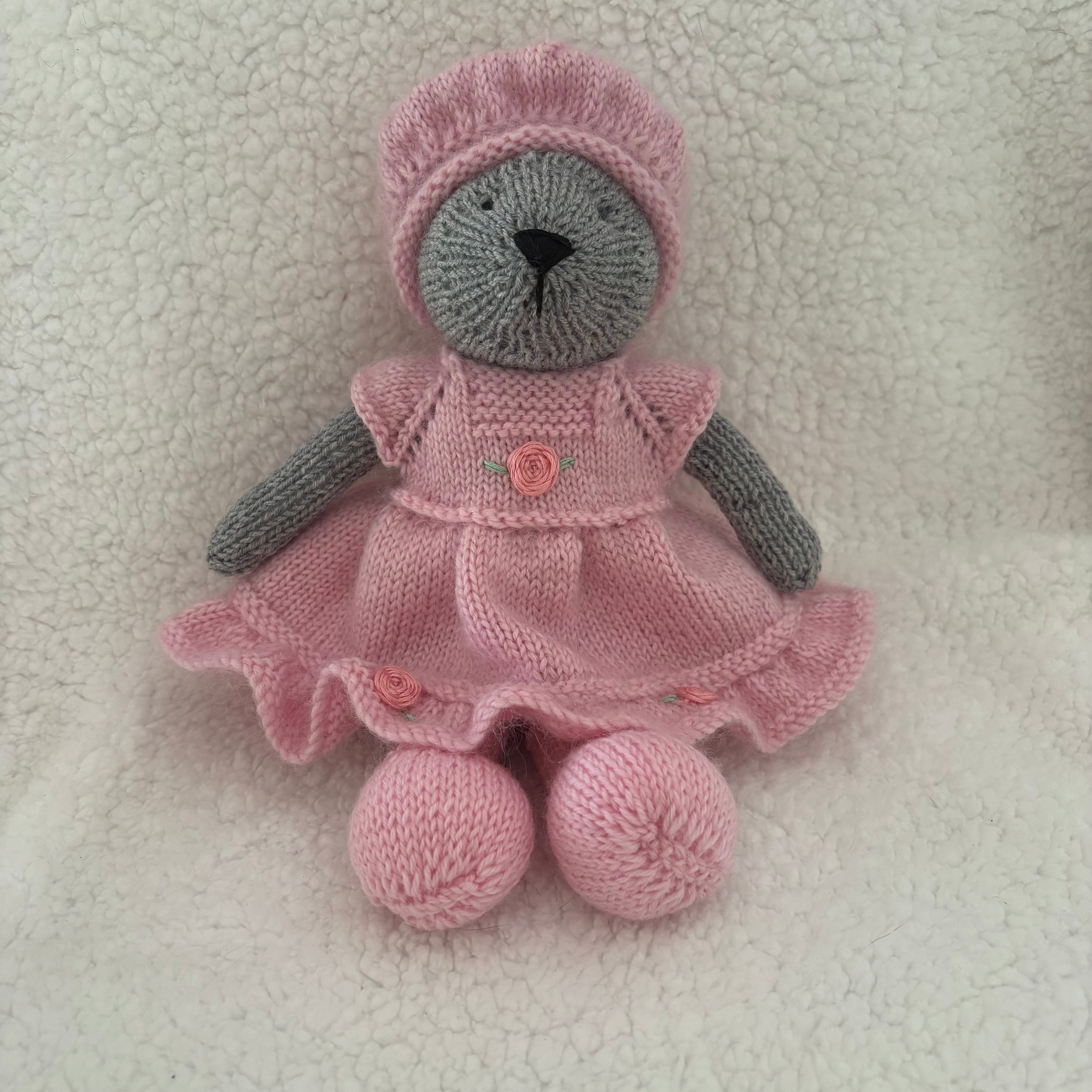 Little knitted bear in dress and beret