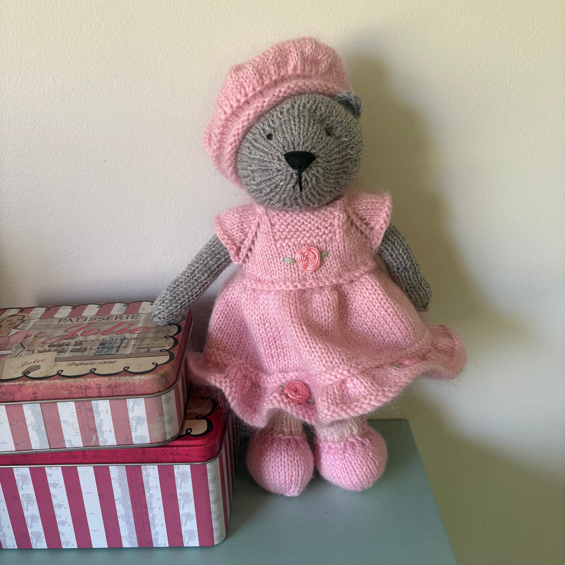 Little knitted bear in dress and beret