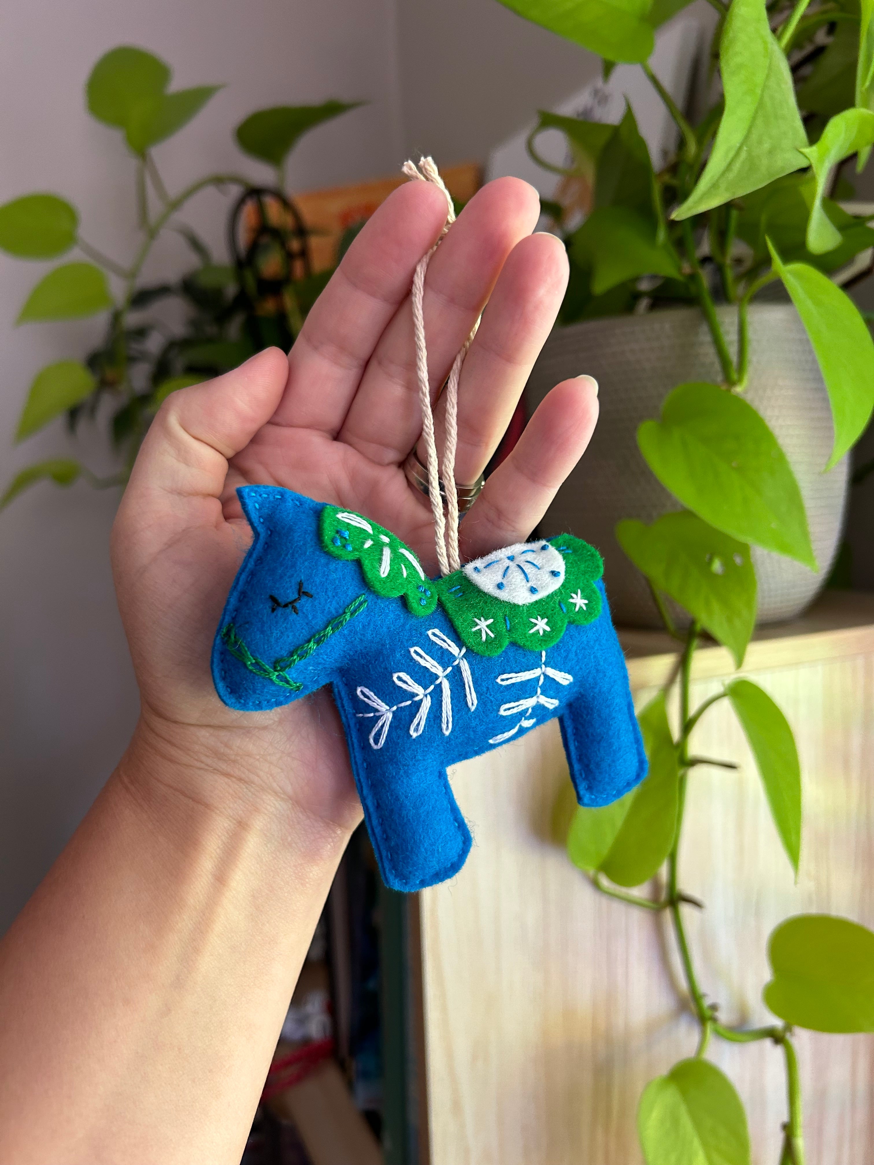 Scandinavian-inspired Dala horse ornament, hand embroidered for timeless holiday charm