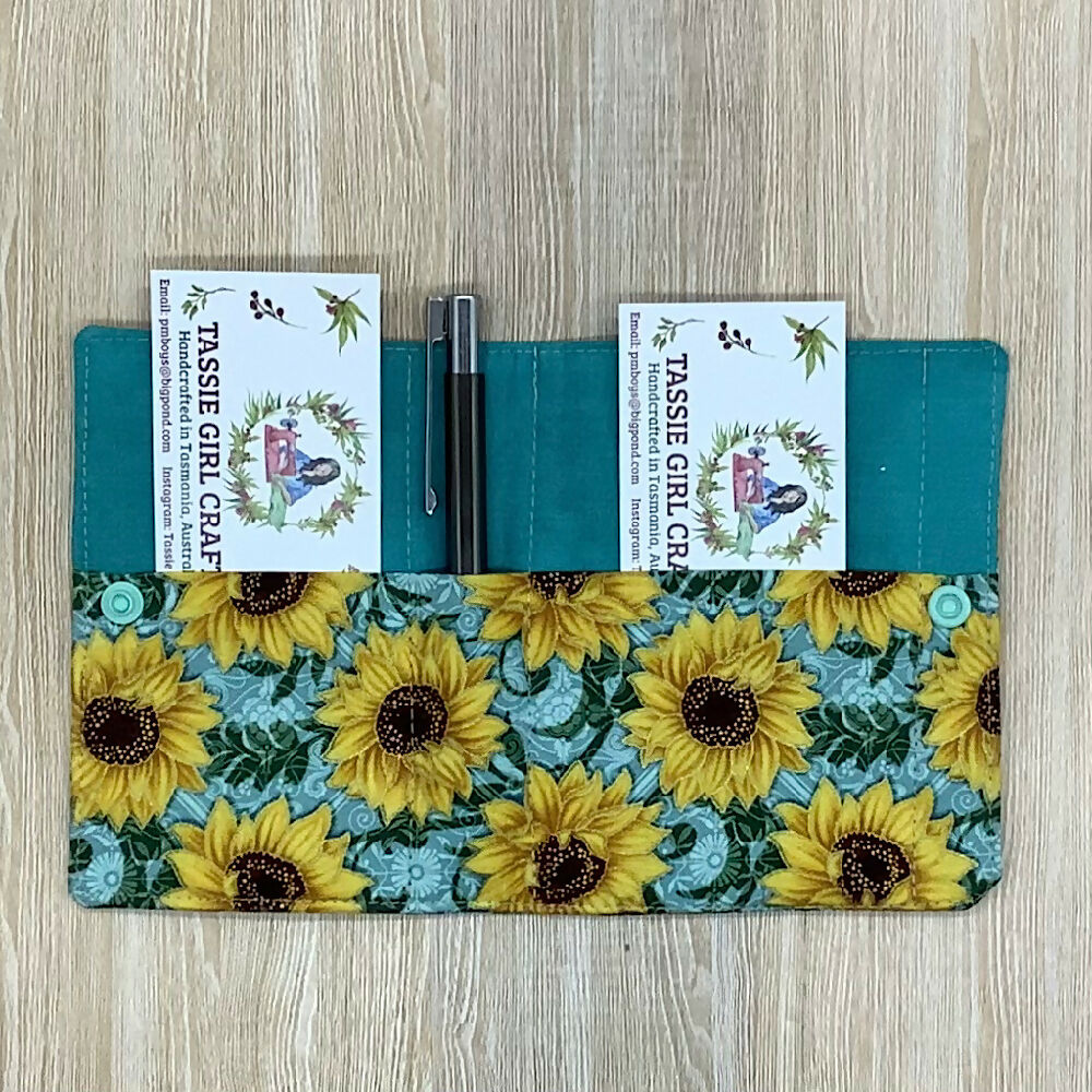 Sunflowers refillable fabric pocket notepad cover with snap closure. Incl. book and pen.