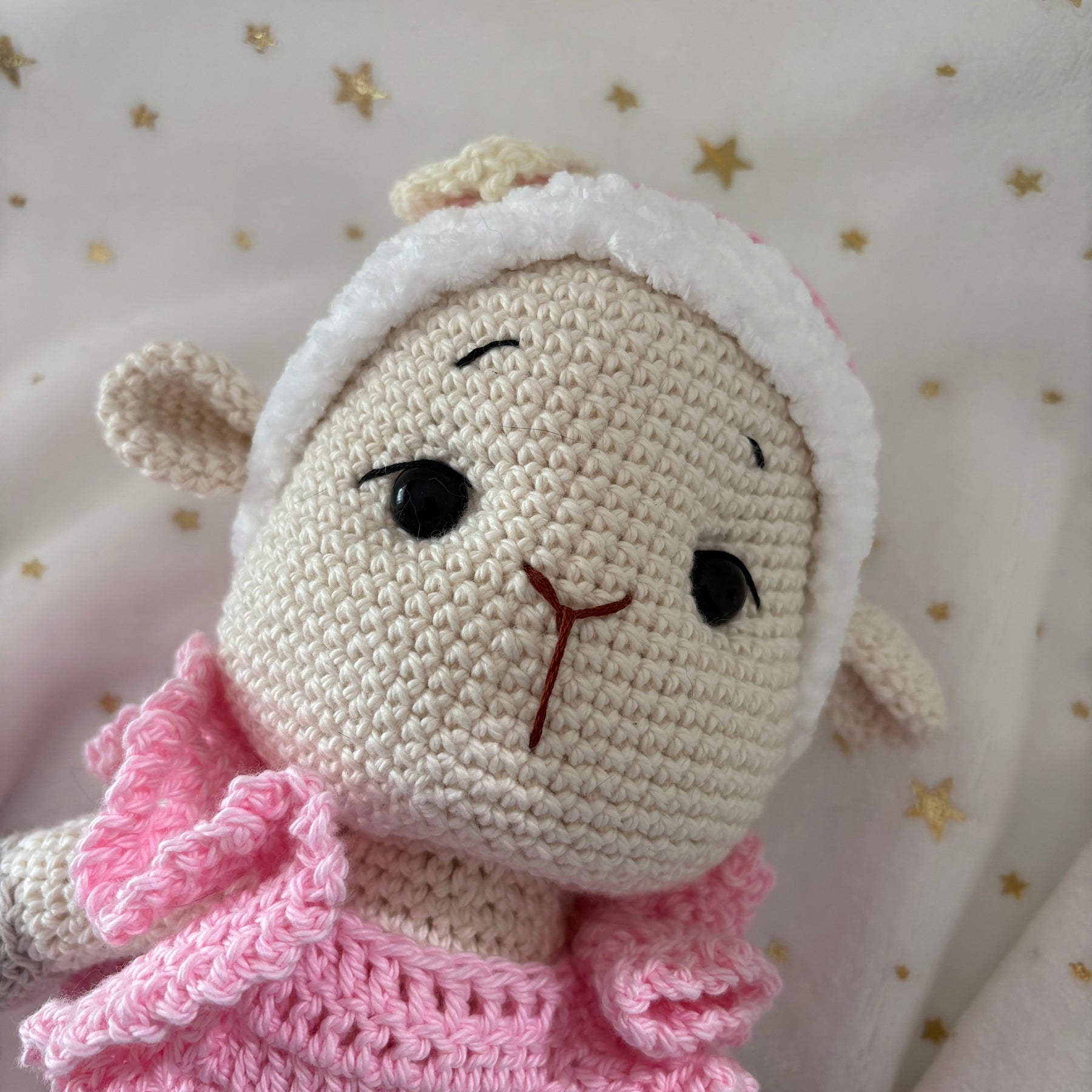 Crochet lamb in pink overalls with heart headband