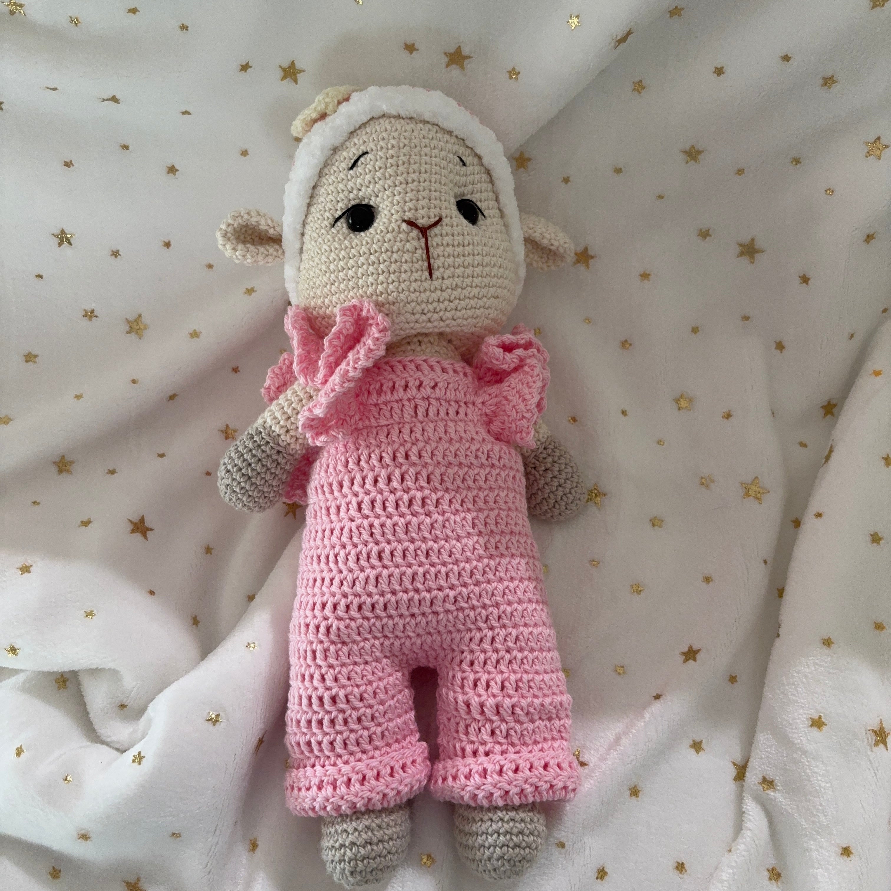 Crochet lamb in pink overalls with heart headband