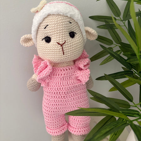 Crochet lamb in pink overalls with heart headband