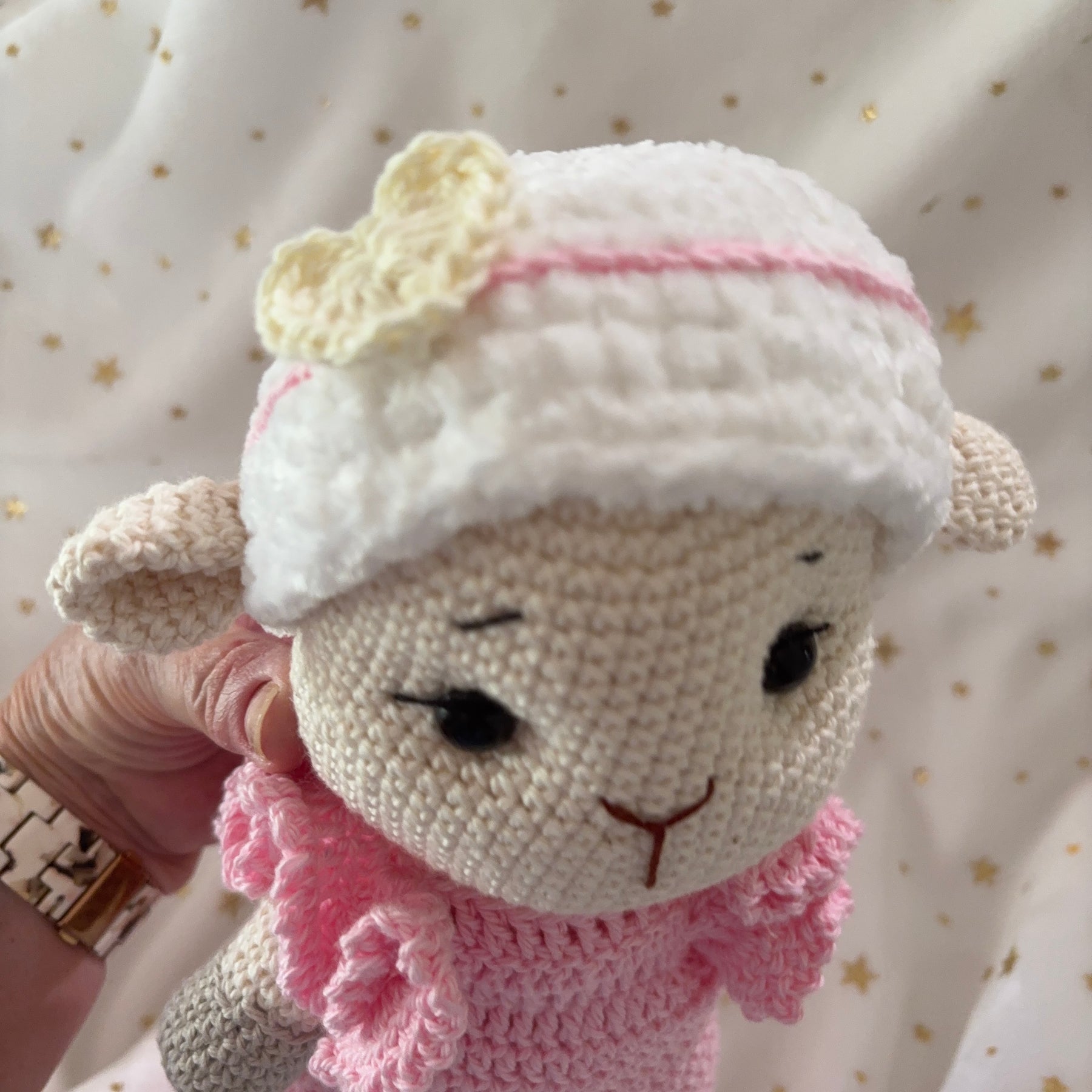 Crochet lamb in pink overalls with heart headband