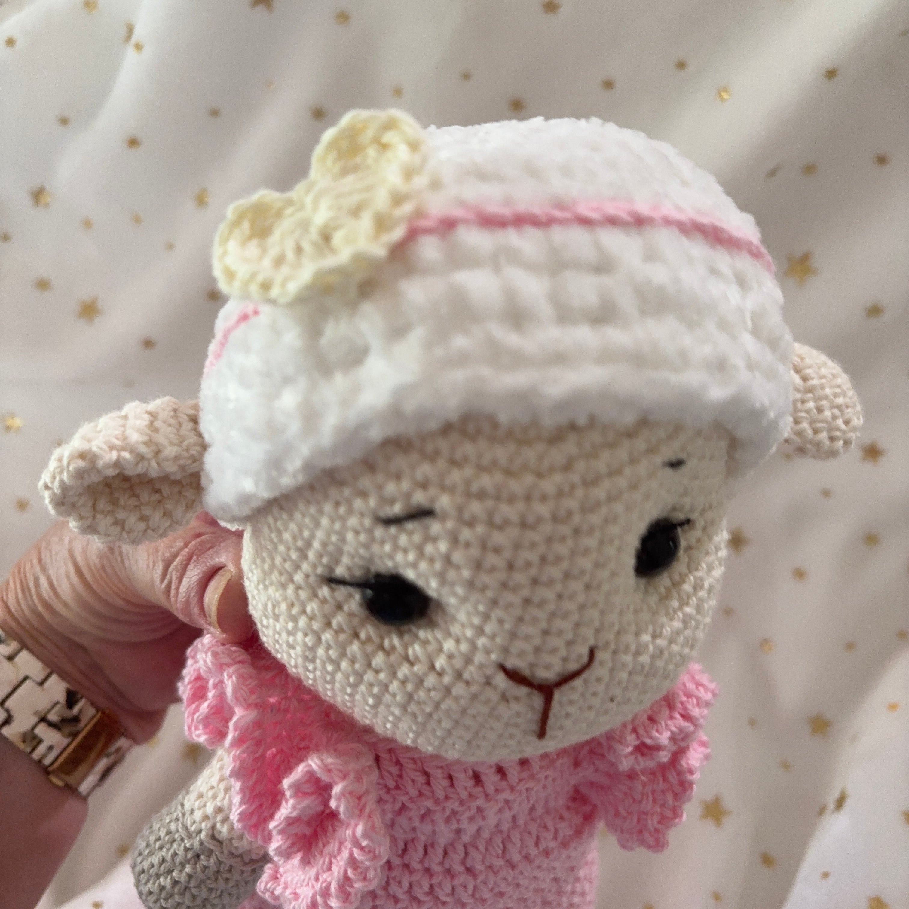 Crochet lamb in pink overalls with heart headband