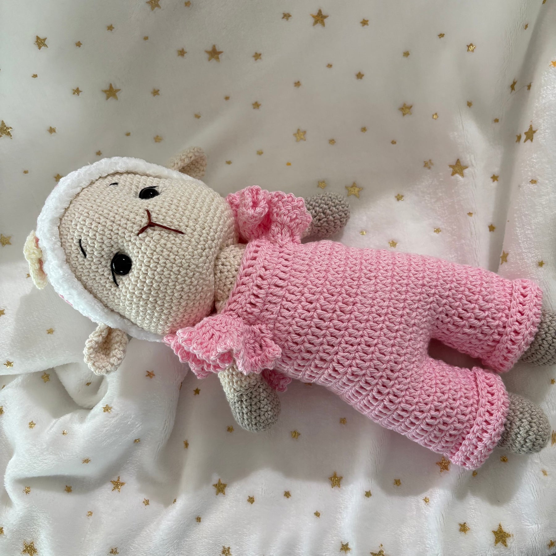 Crochet lamb in pink overalls with heart headband