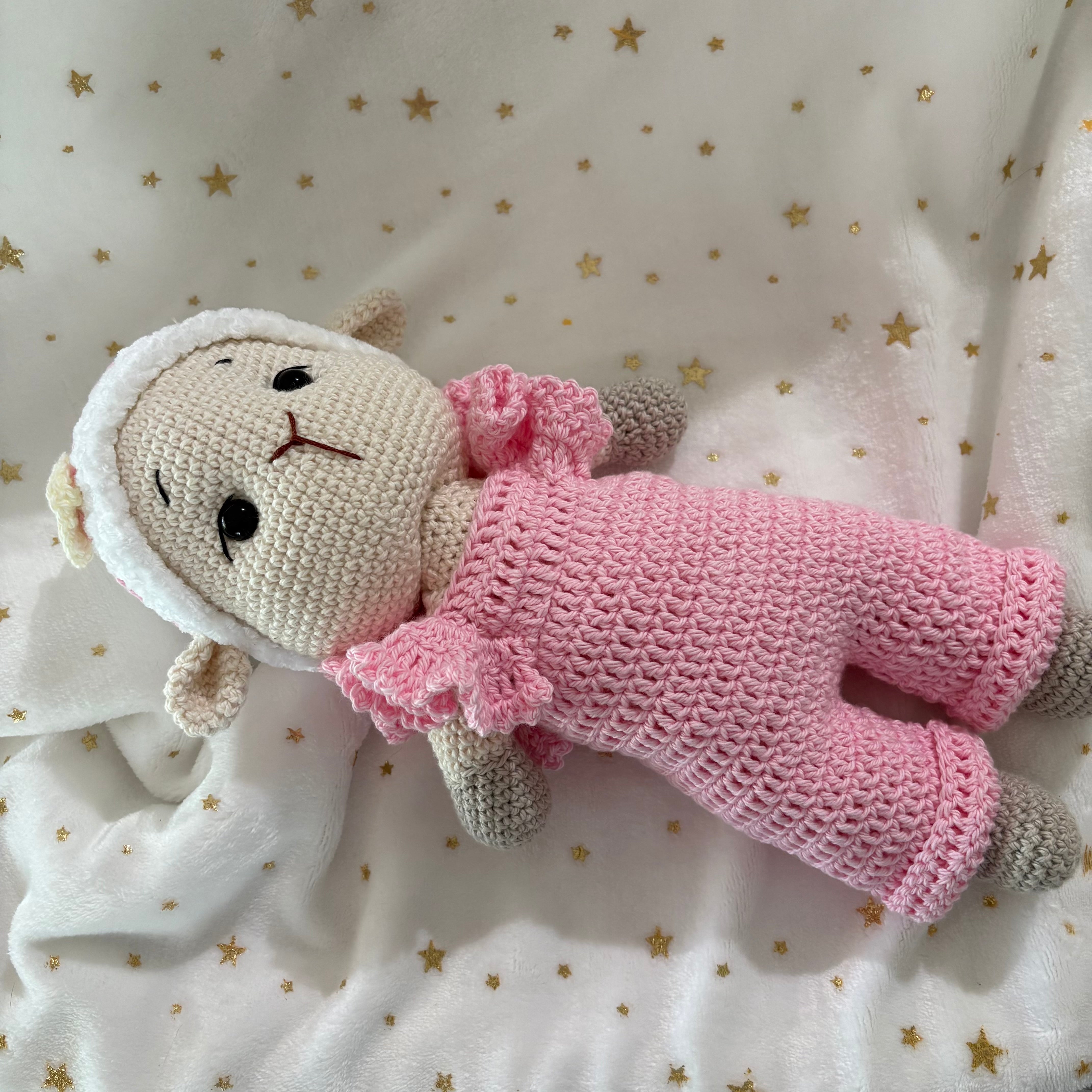 Crochet lamb in pink overalls with heart headband