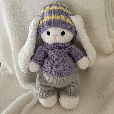 Fluffy bunny in knitted outfit