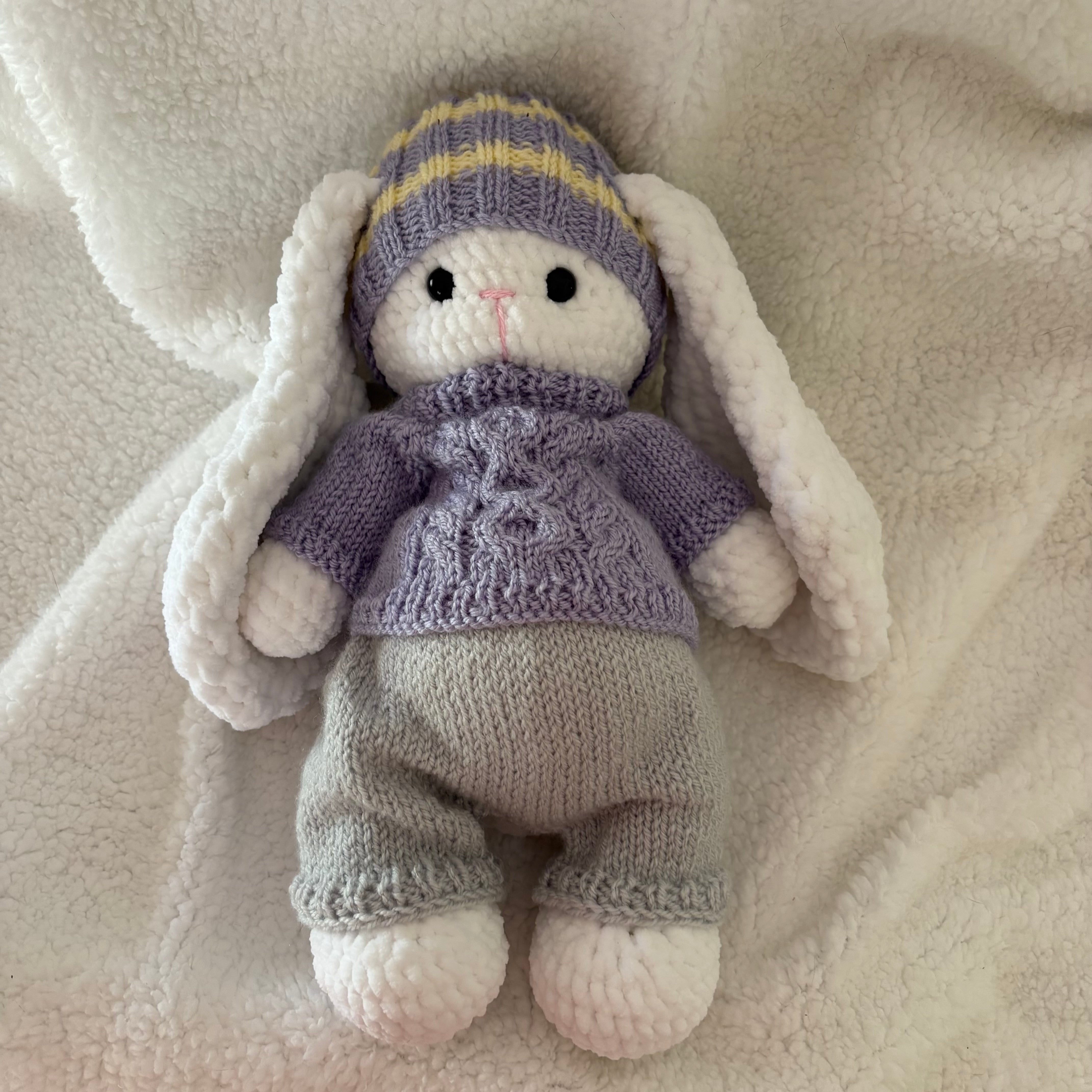 Fluffy bunny in knitted outfit