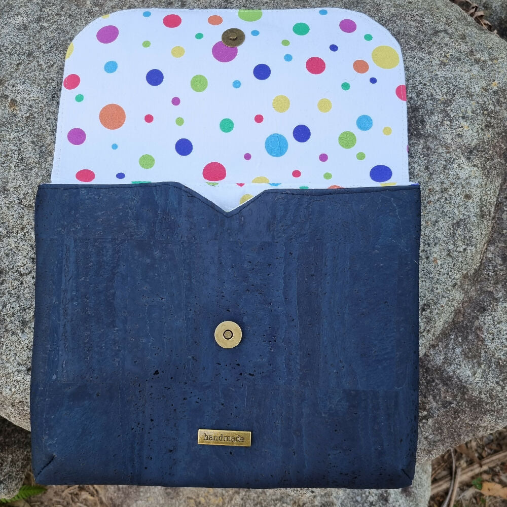 iPad cover or clutch in cork. This view shows the flap lifted revealing a colourful spotted cotton lining.