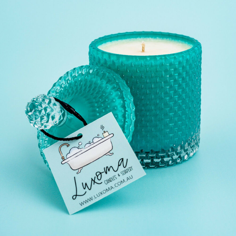 Teal Tear Drop Candle on Teal Background