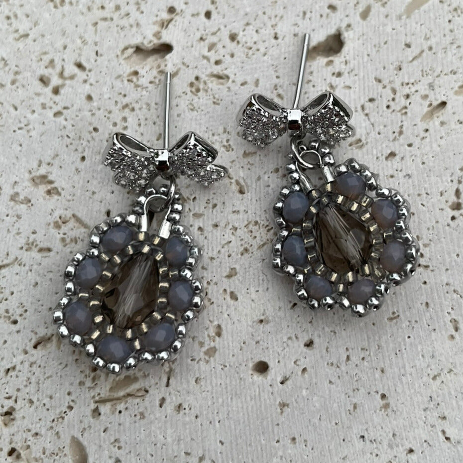 Bow Silver and grey intricate beaded earrings