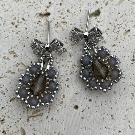 Bow Silver and grey intricate beaded earrings