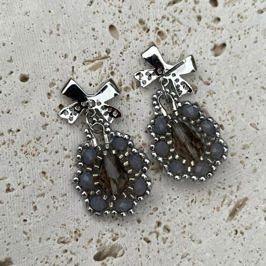 Bow Silver and grey intricate beaded earrings