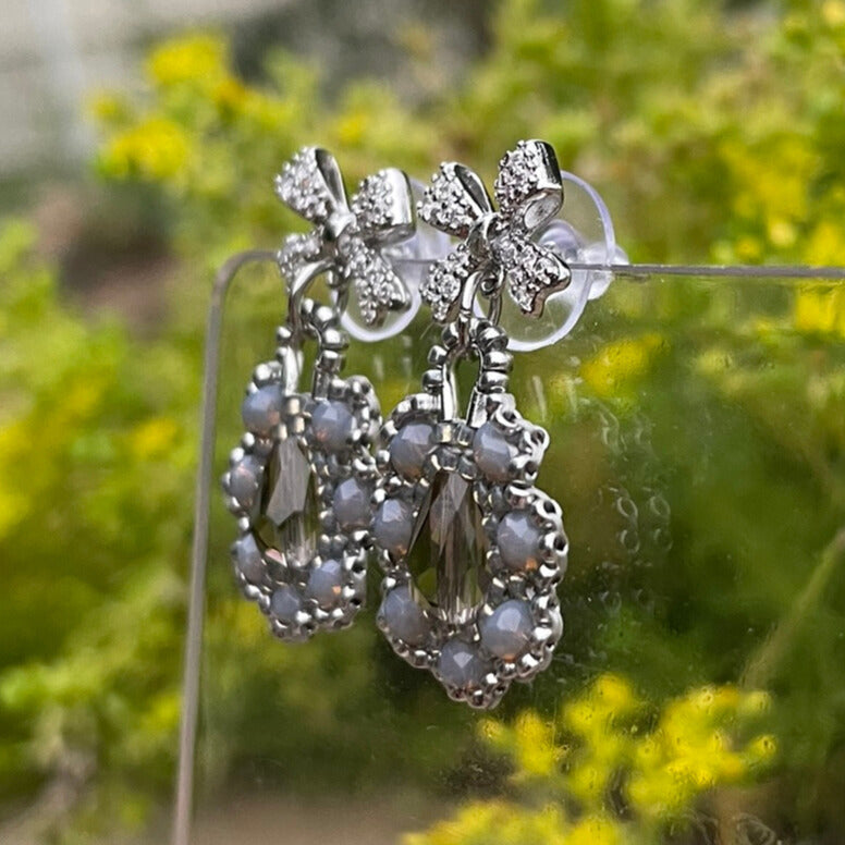 Bow Silver and grey intricate beaded earrings