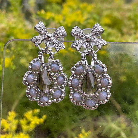 Bow Silver and grey intricate beaded earrings