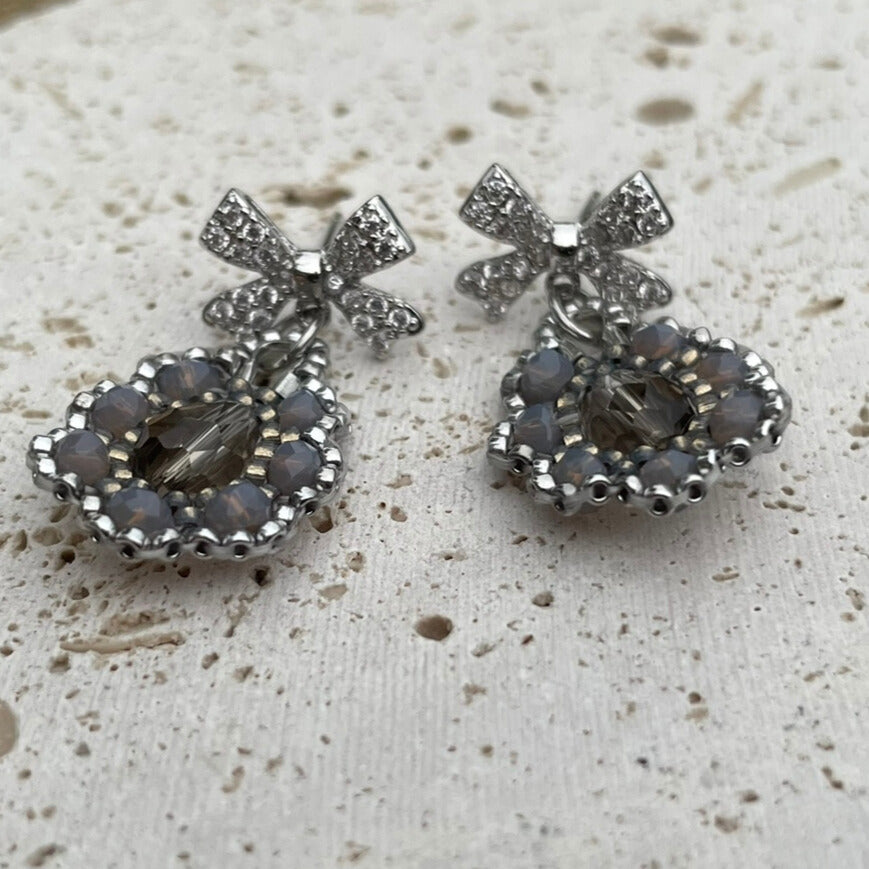 Bow Silver and grey intricate beaded earrings